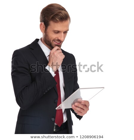 Foto d'archivio: Portrait Of Pensive Businessman Reading From Transparent Gadget