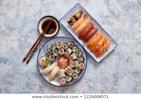 Сток-фото: Asian Food Assortment Various Sushi Rolls Placed On Ceramic Plates