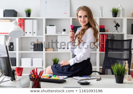 Сток-фото: A Beautiful Young Girl Sat Down On The Table And Held A Pink Marker In Her Hand Before The Girl The