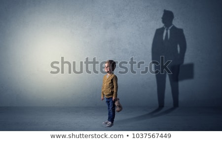 Stock photo: Little Boy With Businessman Shadow