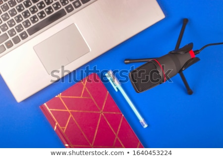 Foto d'archivio: Audio Blogger With Laptop Microphone And Notebook