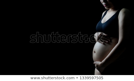 Сток-фото: Pregnant On Black Background