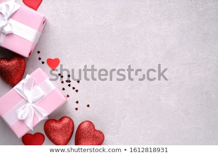 Foto stock: Boyfriend Surprising Girlfriend With Heart Shaped Box