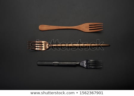 Сток-фото: Three Shniy Metallic Forks On A Wooden Table