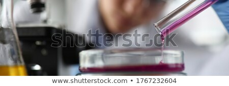 Stockfoto: Assistant Reagent Pouring