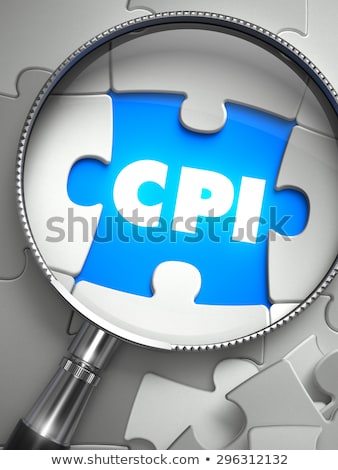 Foto d'archivio: Cpi - Puzzle With Missing Piece Through Loupe