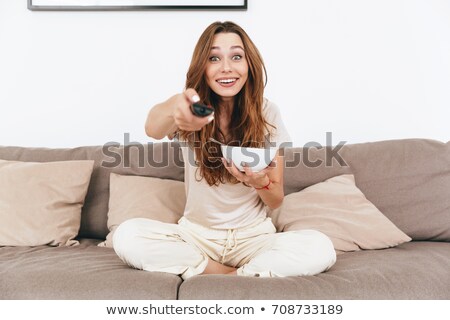 Stock photo: Happy Emotional Amazing Pretty Lady Watch Tv