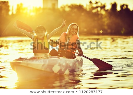 Stockfoto: Happy Family With Kid Kayaking At Tropical Ocean