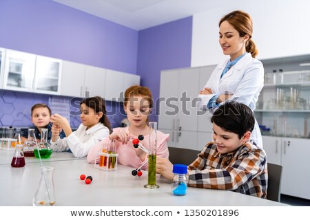 Сток-фото: Cheerful Pupil At Chemistry Classroom