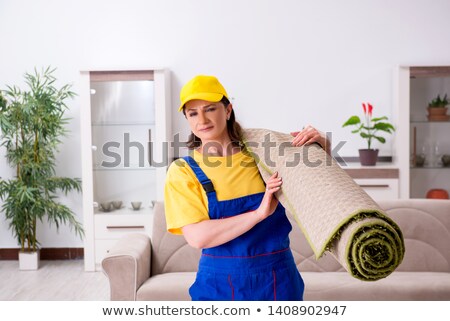 Сток-фото: Old Female Contractor Doing Housework