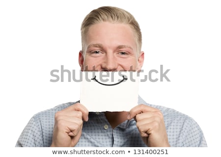 Stockfoto: Person Smiling With A Card In Front Of His Mouth