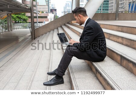 ストックフォト: Businessman Sitting On Stairs With Computer