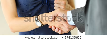 Foto stock: Friendly Handshake Man And Woman Shaking Hands