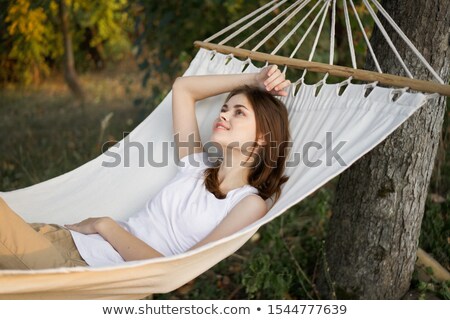 Foto d'archivio: Beautiful Slender Young Woman Enjoying A Lazy Day