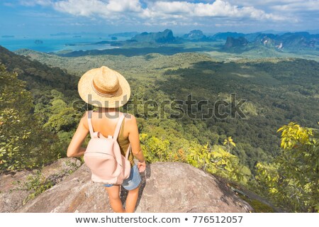 商業照片: Young Tourist Climbing