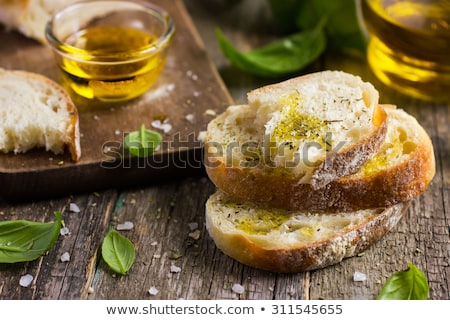 [[stock_photo]]: Fresh Bread With Salt And A Delicious Olive Oil