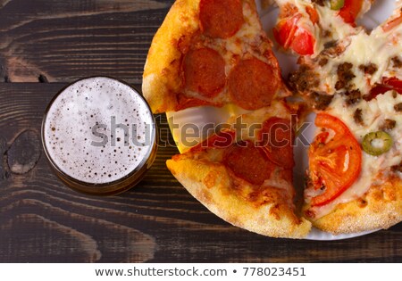 Foto stock: The Beer Red Ale With Snacks On A Dark Background