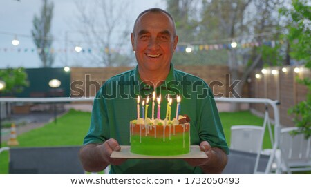 Foto stock: Older Man Enjoying A Festival