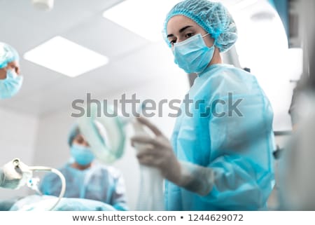 Сток-фото: Doctor And Nurse In Operating Room