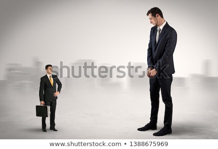 Zdjęcia stock: Giant Businessman Is Afraid Of Small Executor