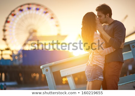 Foto stock: Young Couple Kissing On Beach