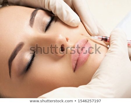 Foto d'archivio: Portrait Of Young Woman Getting Cosmetic Injection Closeup Of