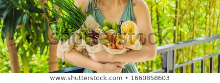 Zdjęcia stock: Set Of Fresh Vegetables In A Reusable Bag In The Hands Of A Young Woman Zero Waste Concept