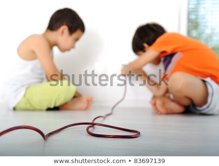 ストックフォト: Dangerous Game Children Experimenting With Electricity