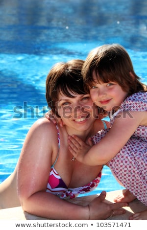 Stock fotó: Happy Family Beside The Swimming Pool