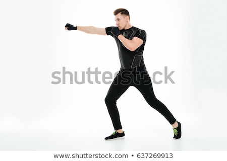 Stockfoto: Young Boxer Man Doing Exercise