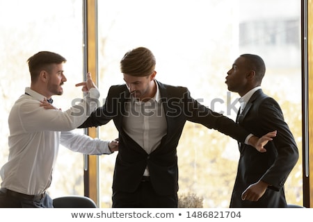 Foto stock: Fighting Corporate Employees