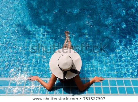 Stock fotó: Beautiful Young Women In A Swimming Pool