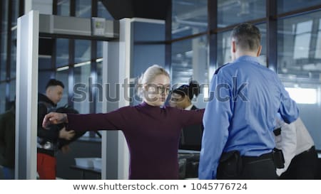 Foto stock: Passengers Going Through Airport Security Check