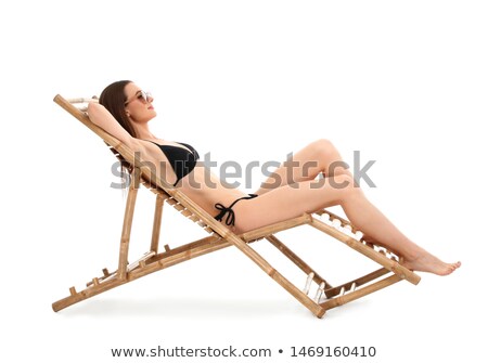 Сток-фото: Happy Women Sunbathing In Chairs On Exotic Beach