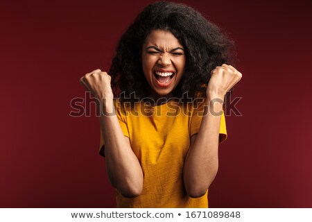 ストックフォト: Image Of Amazed Woman 20s With Curly Hair Rejoicing And Screamin