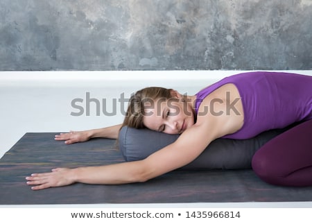 Stockfoto: Young Woman Practicing Yoga With Bolster