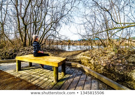 Stockfoto: Senior Woman In The Nice Forest Park