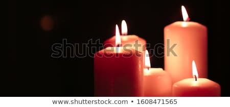 Foto stock: Aromatic Orange Floral Candles Set At Night Christmas New Year
