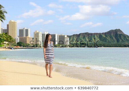 Waikiki Beach Hawaii Travel Tourist Woman Relaxing Walking On Sand At Sunset On Famous Beach Stretch Stockfoto © Maridav