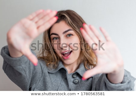 ストックフォト: Woman With Glasses Pulling Air Kiss