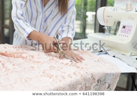 Stock fotó: Female Designer Cutting Cloth