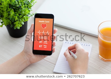 ストックフォト: Doctor Showing App For Measuring Of Heart Pulse