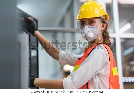 Stock foto: Aschinist, · der · an · der · Maschine · arbeitet