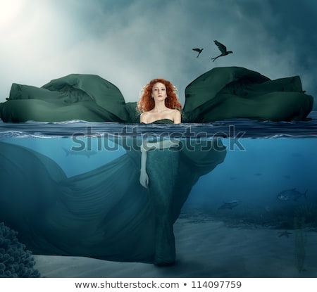 Stockfoto: Young Woman In The Sea With Red Starfishes