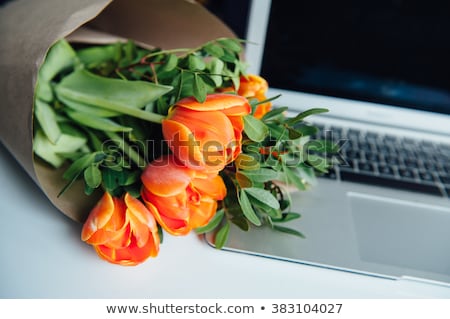 Stockfoto: Laptop On Wooden Floor With Coffee Tulips And Notepad