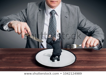 Foto stock: Big Boss Eating Small Businessman