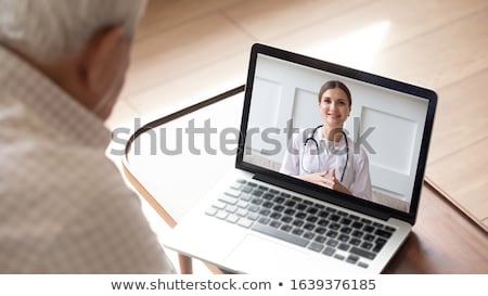 Stok fotoğraf: Senior Woman Patient Having Video Call With Doctor