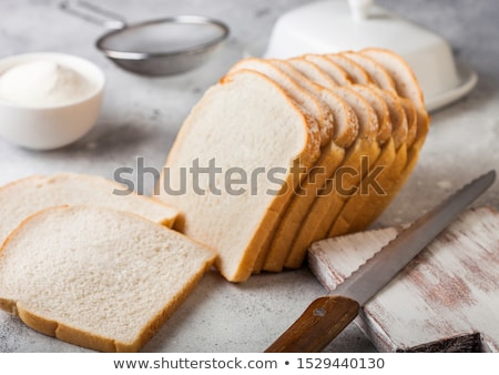 Stock foto: Cut Of Fresh Loaf Of Seeded Brown Bread On White Background Traditional Bakery Heritage