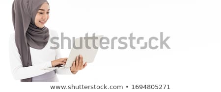 Stock photo: Young Asian Islam Woman Is Sitting Enjoy And Smiling When Working On Laptop On White Background