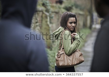 [[stock_photo]]: Teenage Girl Feeling Intimidated As She Walks Home